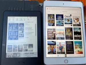 A Kindle Paperwhite (left) and the Kindle App on min iPad